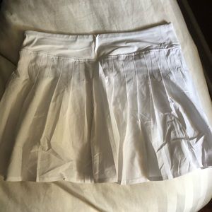 White pleaded tennis skirt